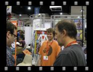 At Mike and Laura's area. Mike is talking to a fan while his son, Han smiles for the camera.